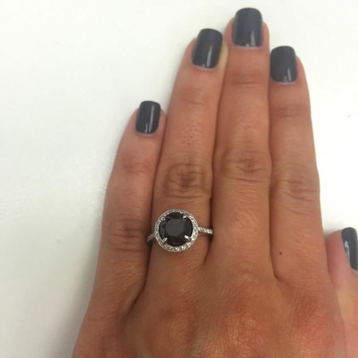 diamond ring on black hand