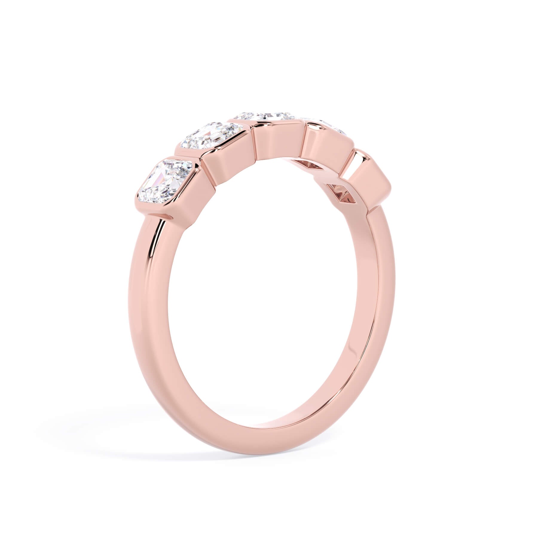 A picture of a five stone diamond wedding ring with asscher shape diamonds that are bezel set in rose gold on a white background with a slightly angled, through the finger view.