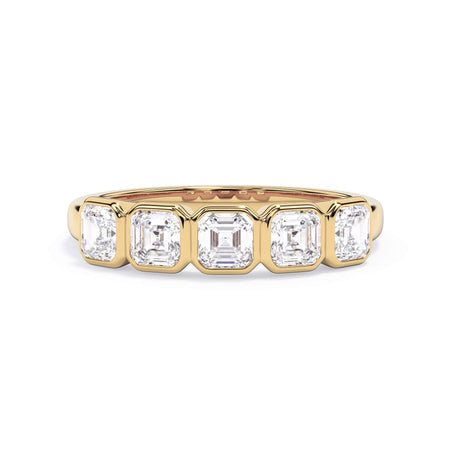 A picture of a five stone diamond wedding ring with asscher shape diamonds that are bezel set in yellow gold on a white background with the ring facing forward, lying down.