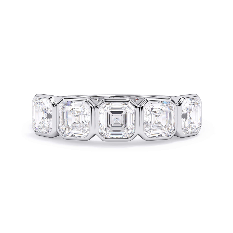 A picture of a five stone diamond wedding ring with asscher shape diamonds that are bezel set in white gold or platinum on a white background with the ring facing forward, lying down.