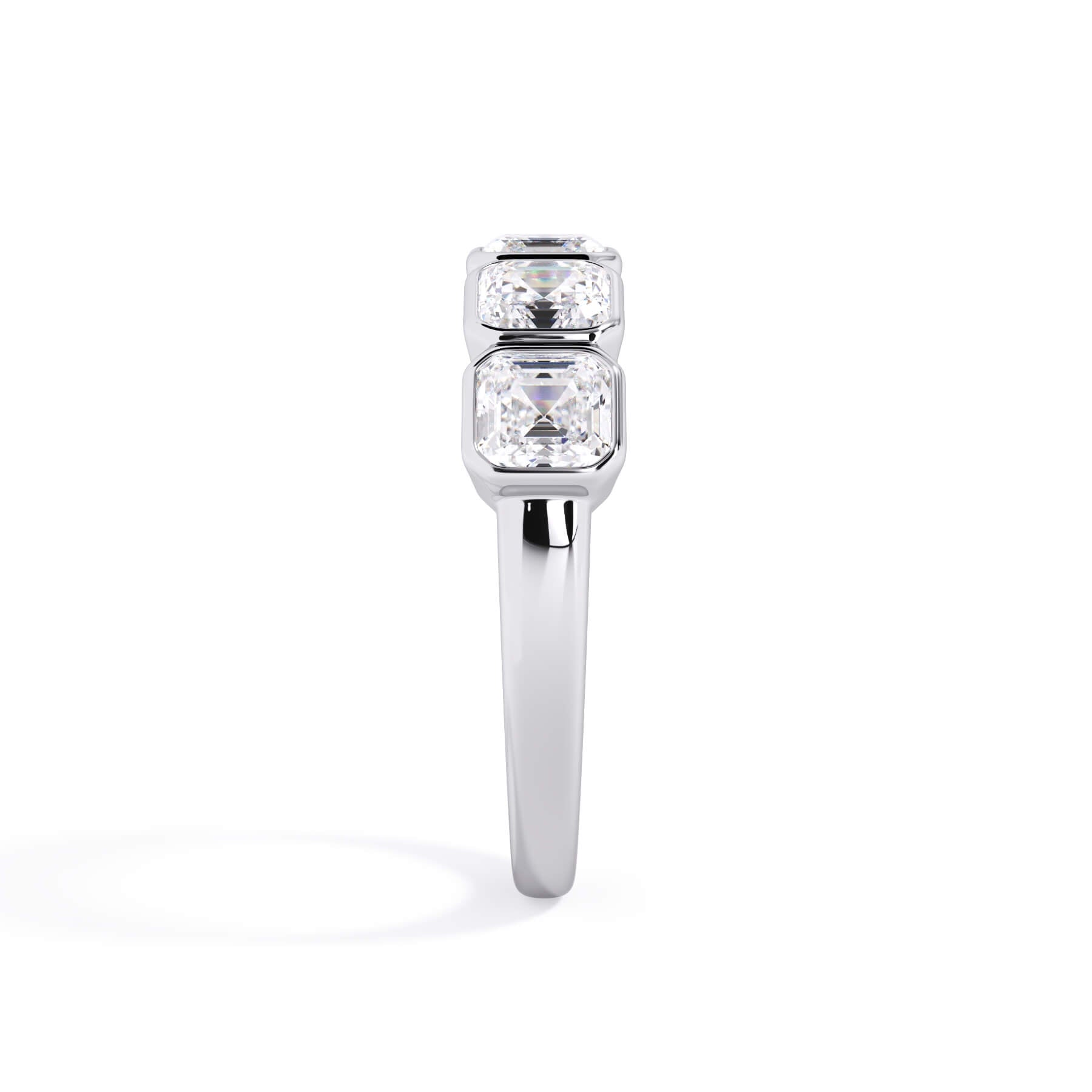 A picture of a five stone diamond wedding ring with asscher shape diamonds that are bezel set in white gold or platinum on a white background with a side profile view.