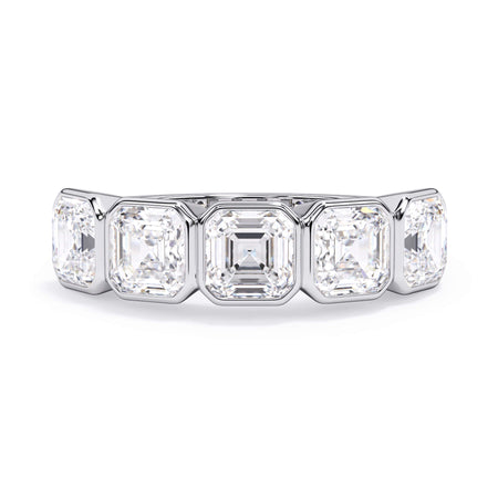 A picture of a five stone diamond wedding ring with asscher shape diamonds that are bezel set in white gold or platinum on a white background with the ring facing forward, lying down.