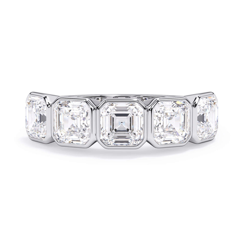 A picture of a five stone diamond wedding ring with asscher shape diamonds that are bezel set in white gold or platinum on a white background with the ring facing forward, lying down.