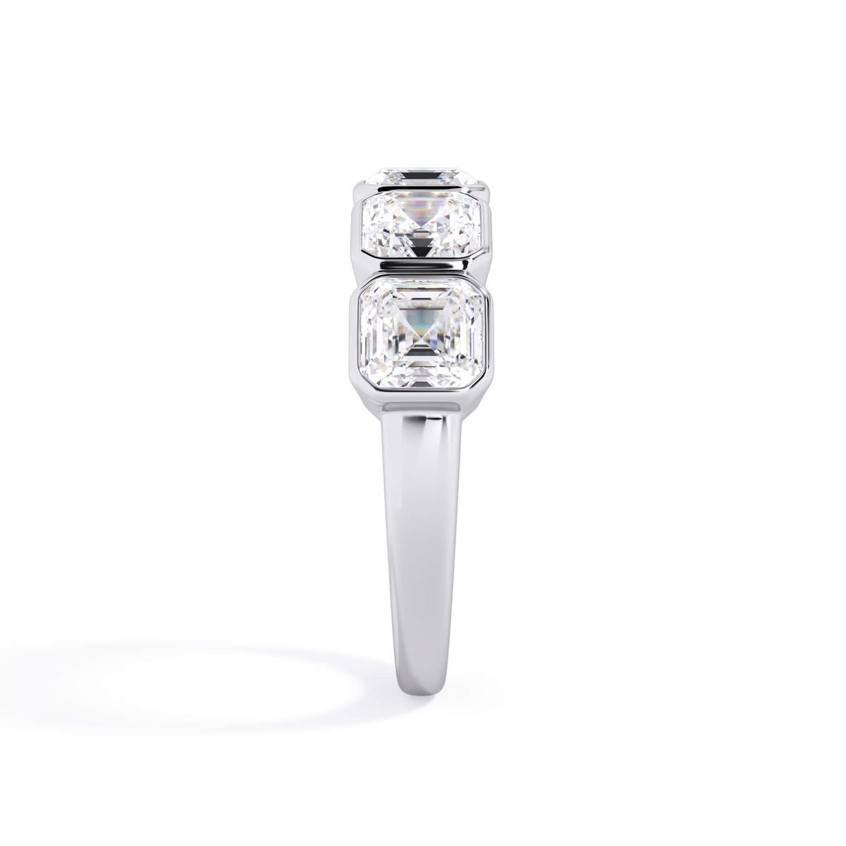 A picture of a five stone diamond wedding ring with asscher shape diamonds that are bezel set in white gold or platinum on a white background with a side profile view.
