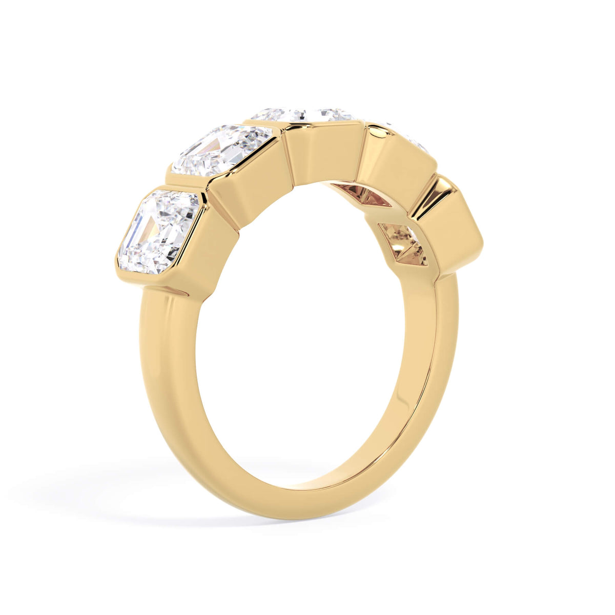 A picture of a five stone diamond wedding ring with asscher shape diamonds that are bezel set in yellow gold on a white background with a slightly angled, through the finger view.