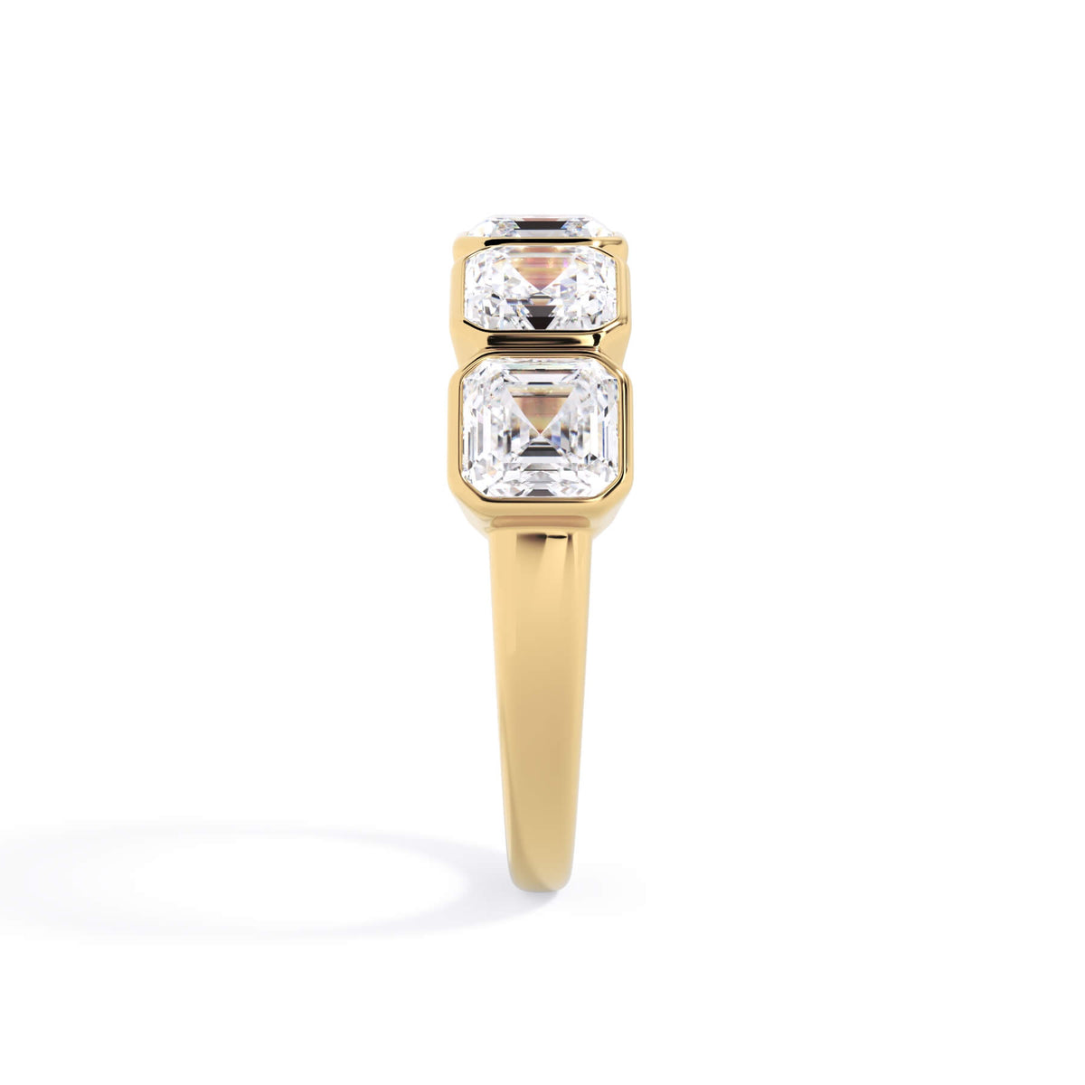 A picture of a five stone diamond wedding ring with asscher shape diamonds that are bezel set in yellow gold on a white background with a side profile view.