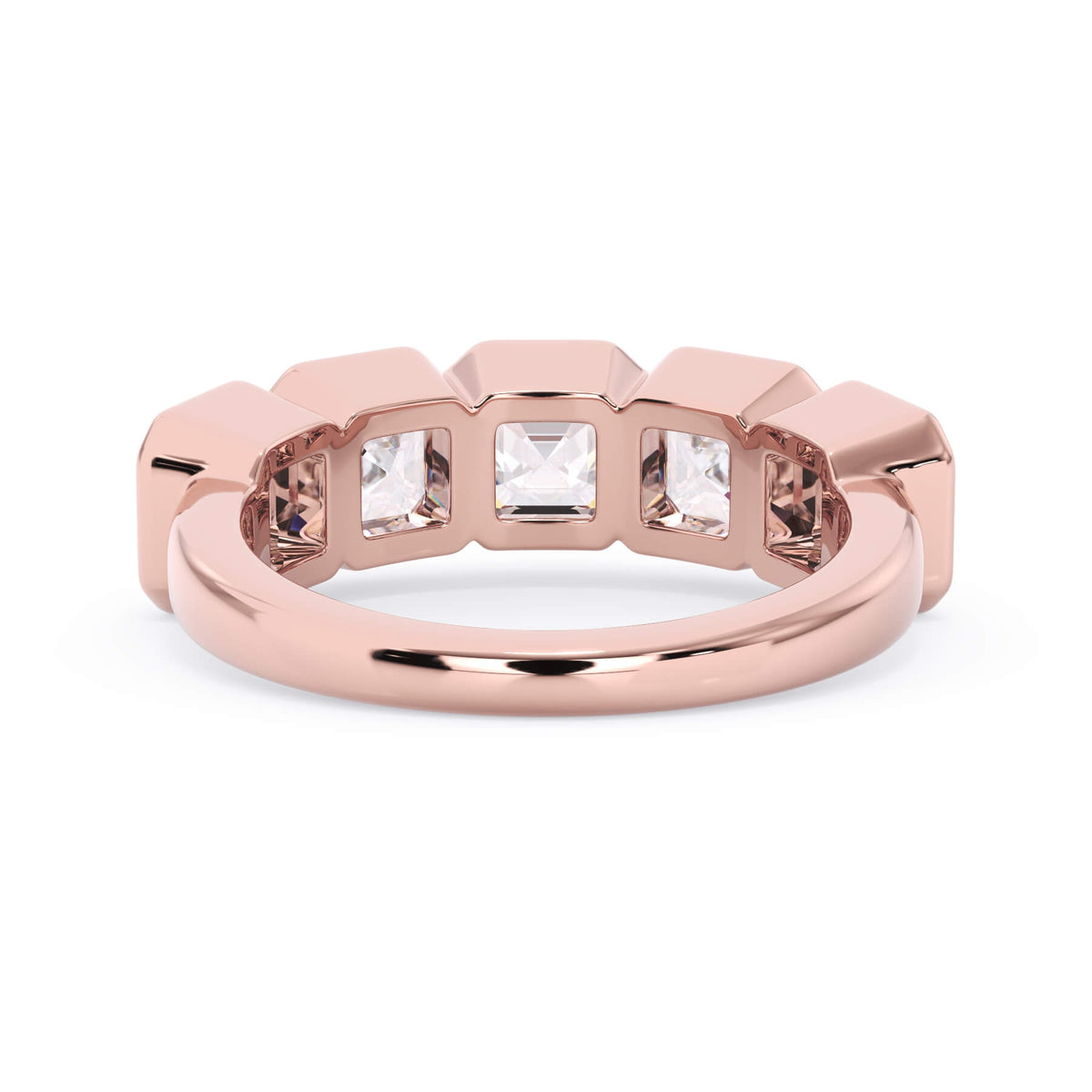 A picture of a five stone diamond wedding ring with asscher shape diamonds that are bezel set in rose gold on a white background with a view of the underside of the ring.