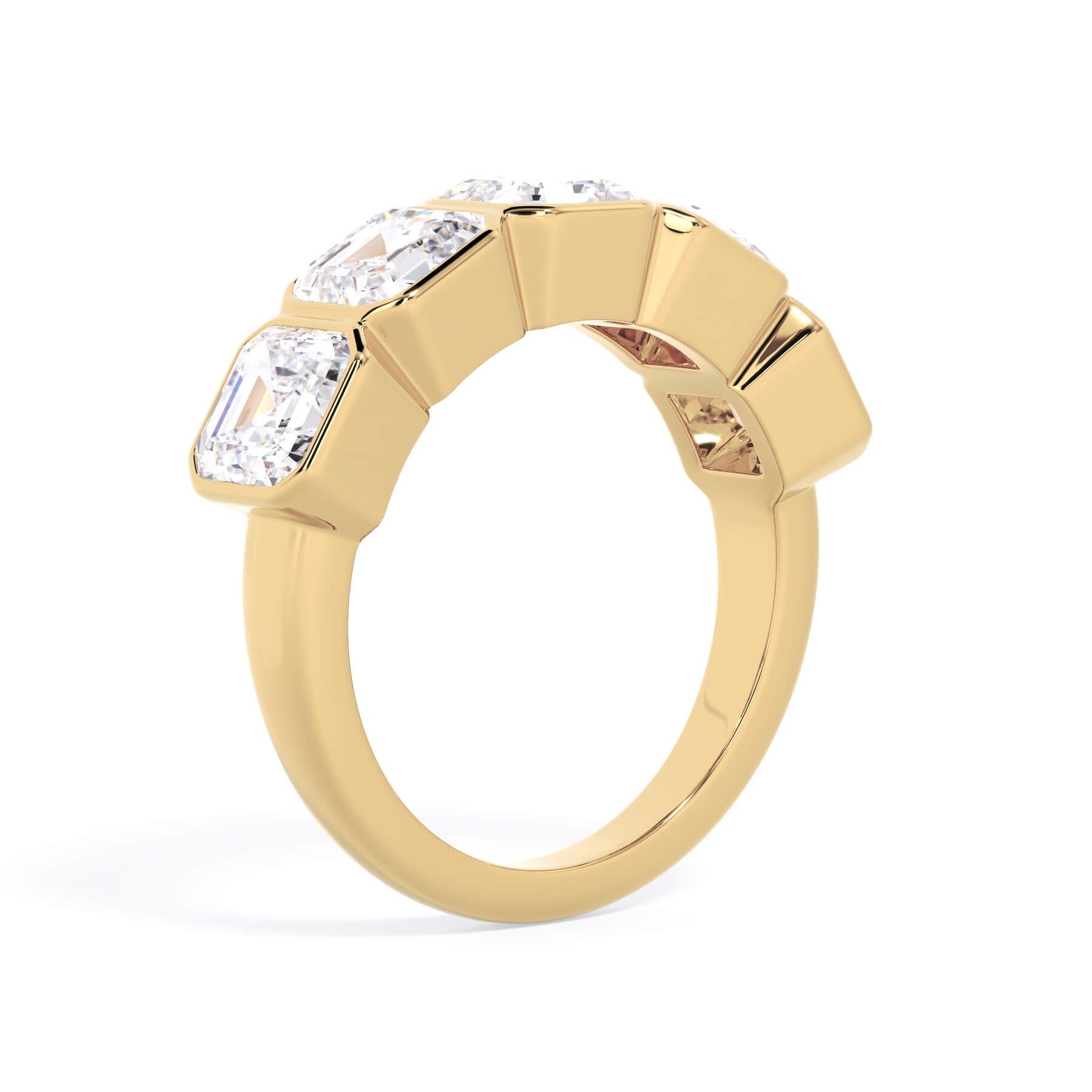 A picture of a five stone diamond wedding ring with asscher shape diamonds that are bezel set in yellow gold on a white background with a slightly angled, through the finger view.