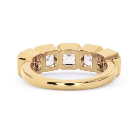A picture of a five stone diamond wedding ring with asscher shape diamonds that are bezel set in yellow gold on a white background with a view of the underside of the ring.