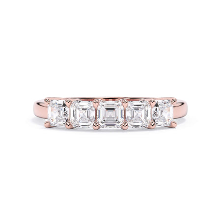 A picture of a five stone diamond wedding ring with asscher shape diamonds that are shared prong set in rose gold on a white background with the ring facing forward, lying down.