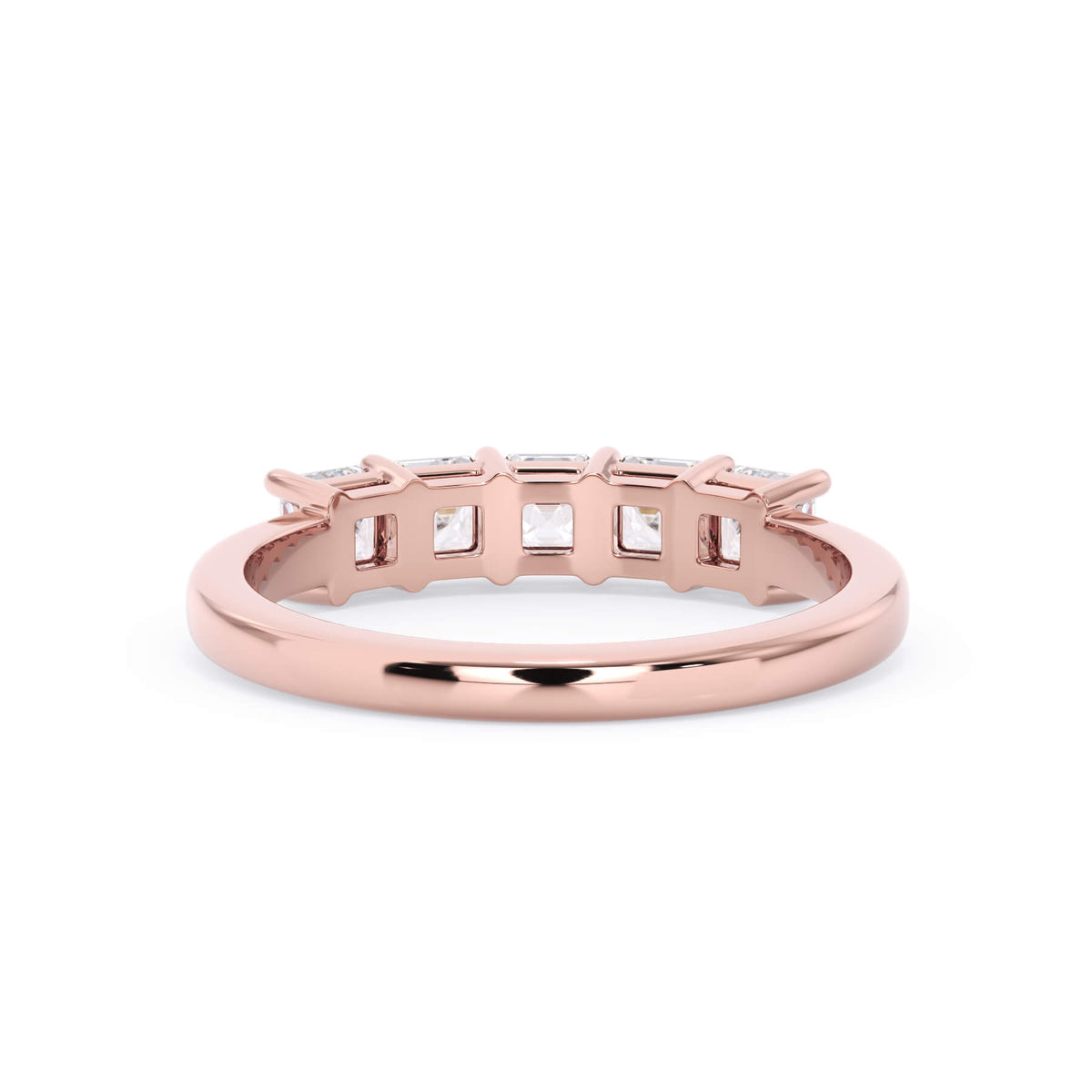 A picture of a five stone diamond wedding ring with asscher shape diamonds that are shared prong set in rose gold on a white background with a view of the underside of the ring.