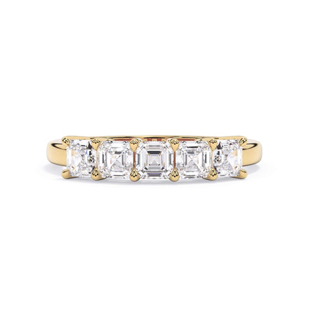 A picture of a five stone diamond wedding ring with asscher shape diamonds that are shared prong set in yellow gold on a white background with the ring facing forward, lying down.