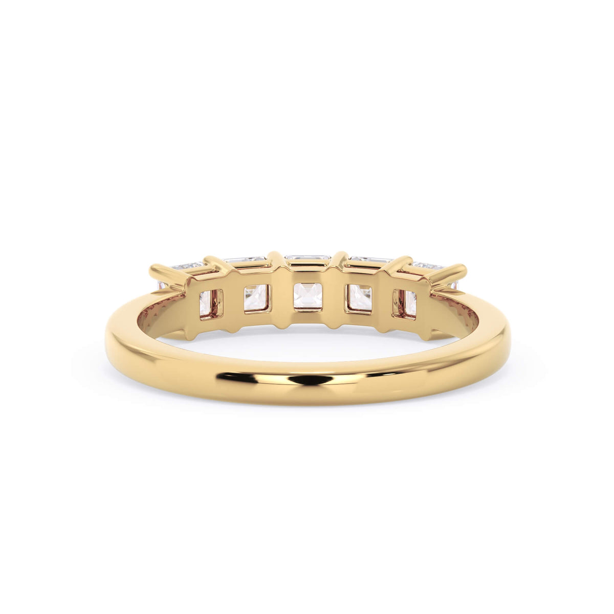 A picture of a five stone diamond wedding ring with asscher shape diamonds that are shared prong set in yellow gold on a white background with a view of the underside of the ring.