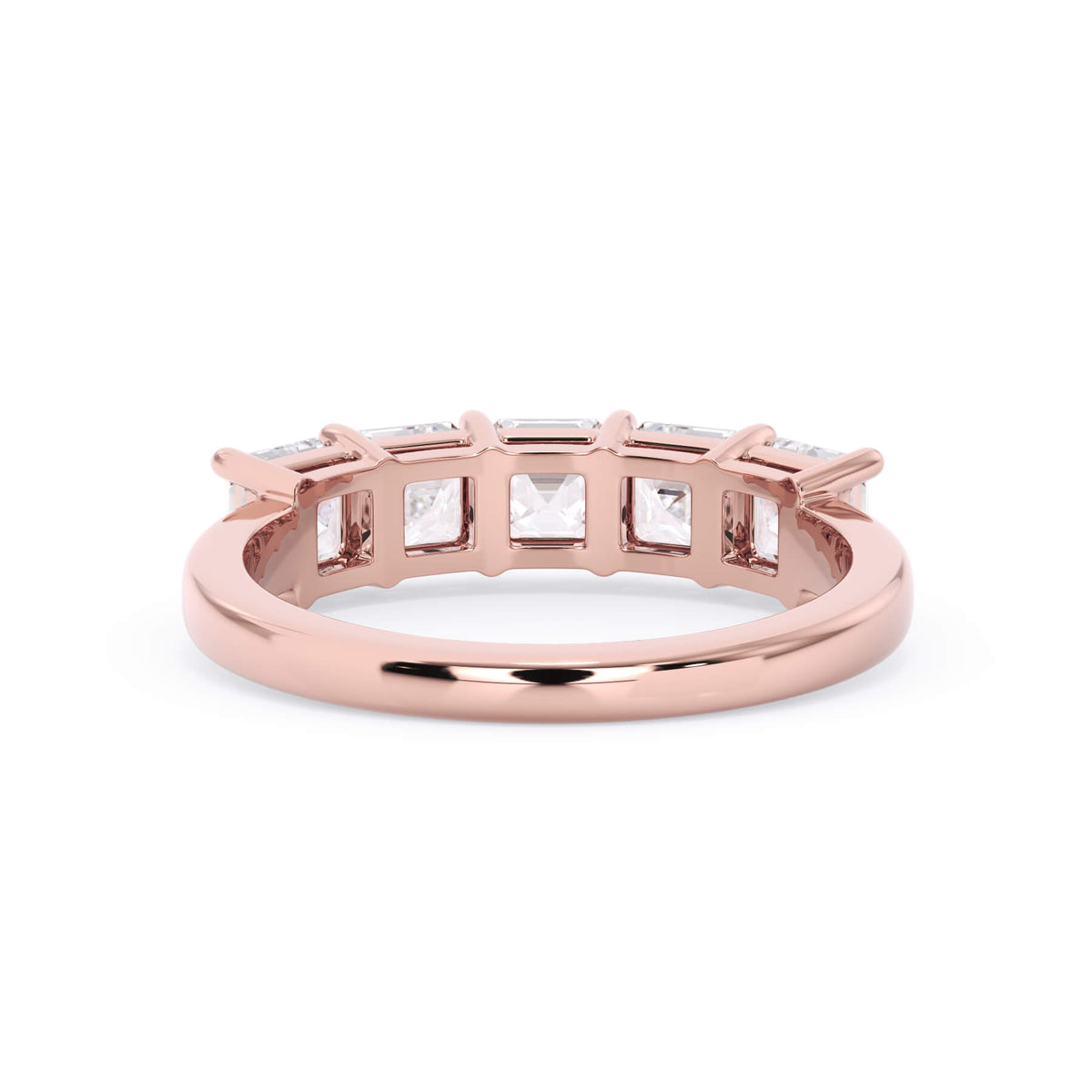 A picture of a five stone diamond wedding ring with asscher shape diamonds that are shared prong set in rose gold on a white background with a view of the underside of the ring.