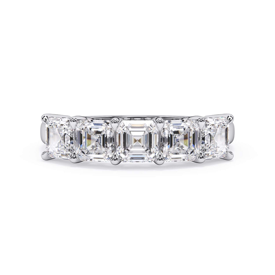 A picture of a five stone diamond wedding ring with asscher shape diamonds that are shared prong set in white gold or platinum on a white background with the ring facing forward, lying down.