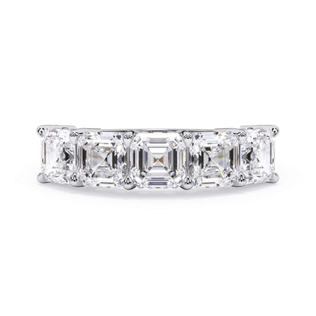 A picture of a five stone diamond wedding ring with asscher shape diamonds that are shared prong set in white gold or platinum on a white background with the ring facing forward, lying down.