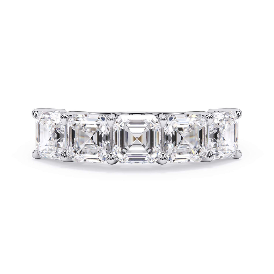 A picture of a five stone diamond wedding ring with asscher shape diamonds that are shared prong set in white gold or platinum on a white background with the ring facing forward, lying down.