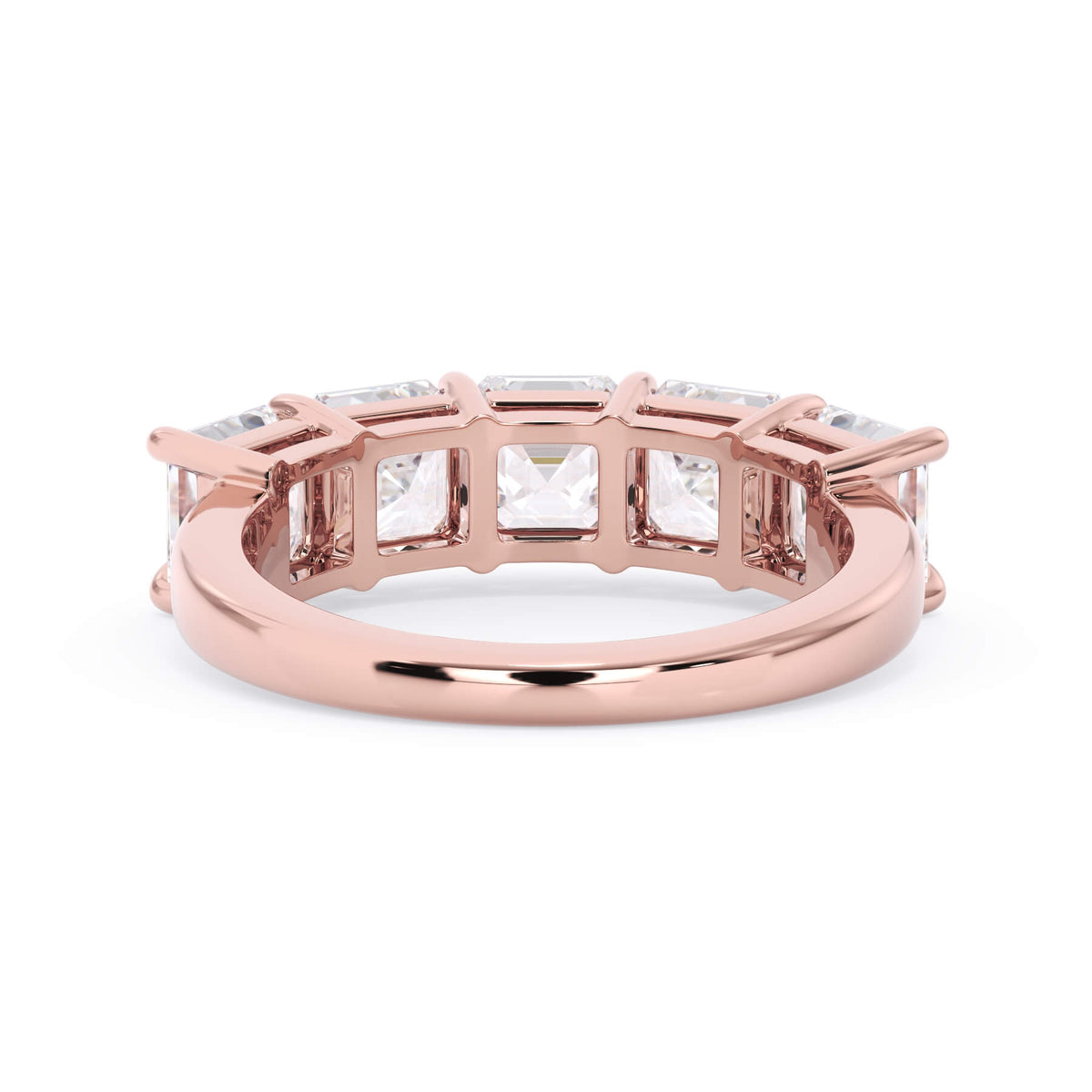 A picture of a five stone diamond wedding ring with asscher shape diamonds that are shared prong set in rose gold on a white background with a view of the underside of the ring.