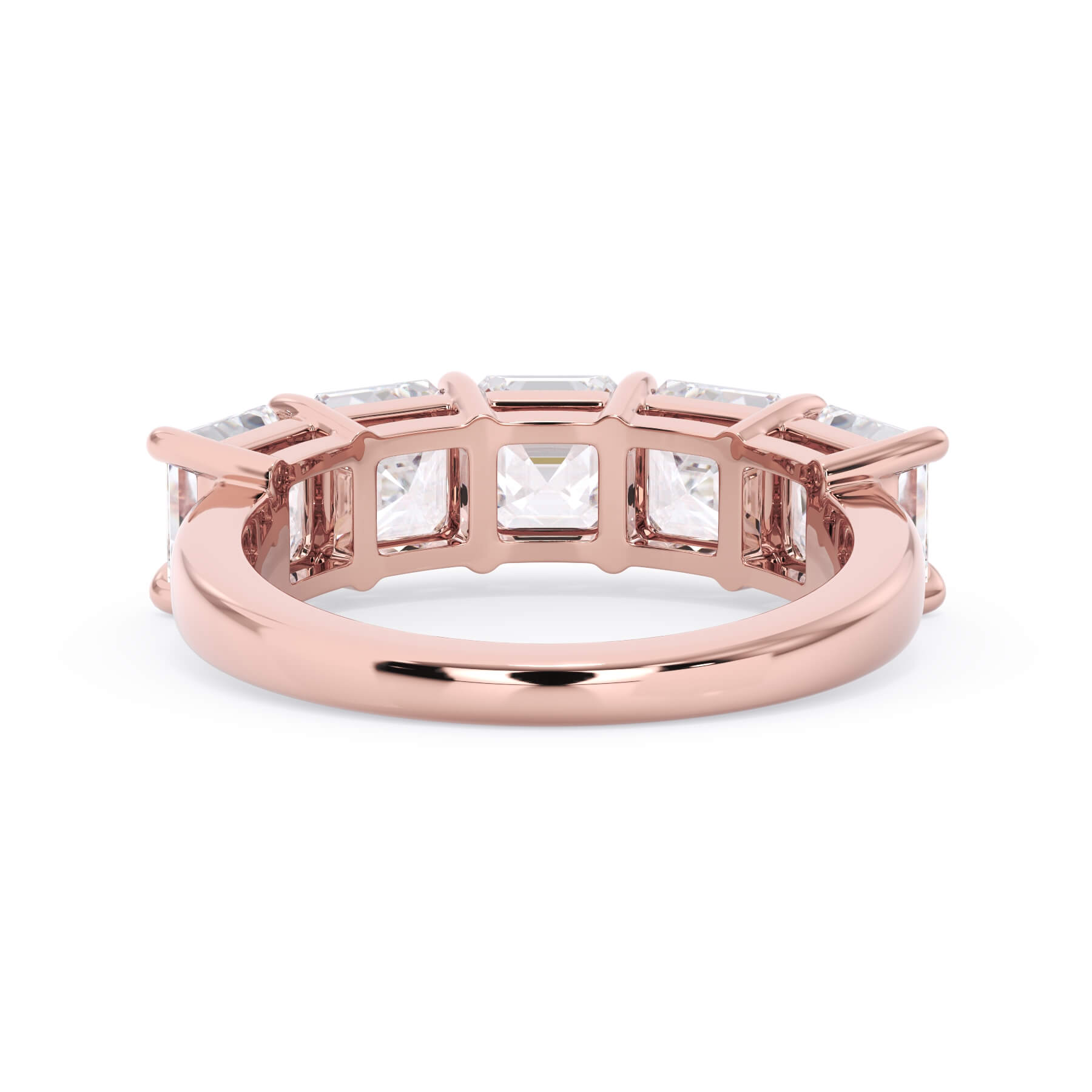 A picture of a five stone diamond wedding ring with asscher shape diamonds that are shared prong set in rose gold on a white background with a view of the underside of the ring.