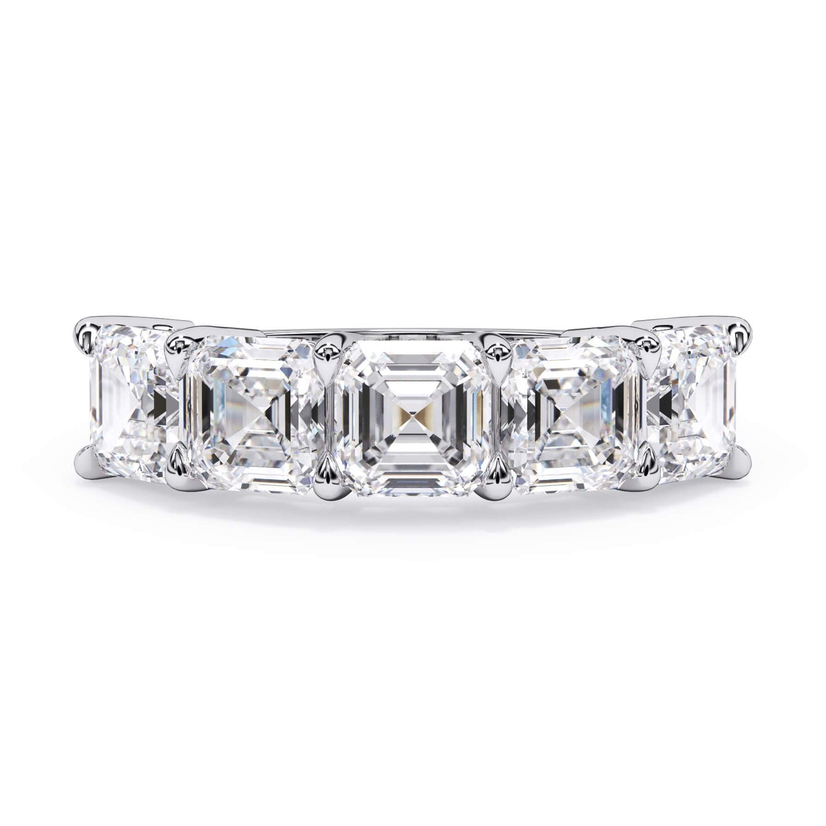 A picture of a five stone diamond wedding ring with asscher shape diamonds that are shared prong set in white gold or platinum on a white background with the ring facing forward, lying down.