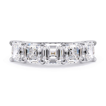 A picture of a five stone diamond wedding ring with asscher shape diamonds that are shared prong set in white gold or platinum on a white background with the ring facing forward, lying down.