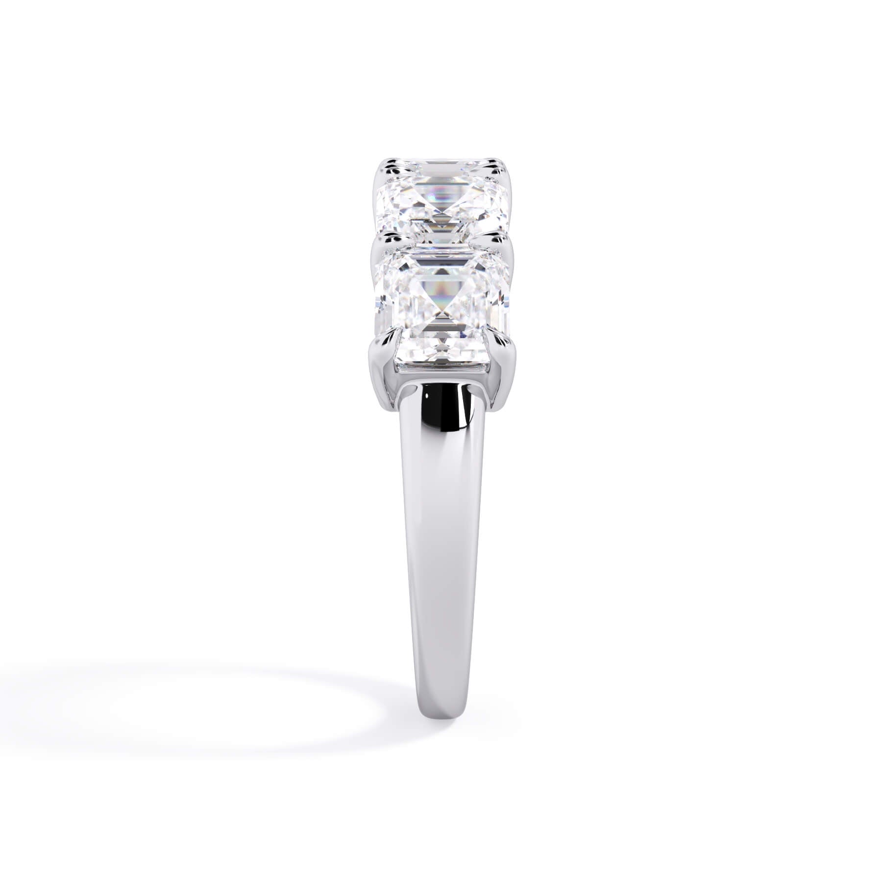 A picture of a five stone diamond wedding ring with asscher shape diamonds that are shared prong set in white gold or platinum on a white background with a side profile view.