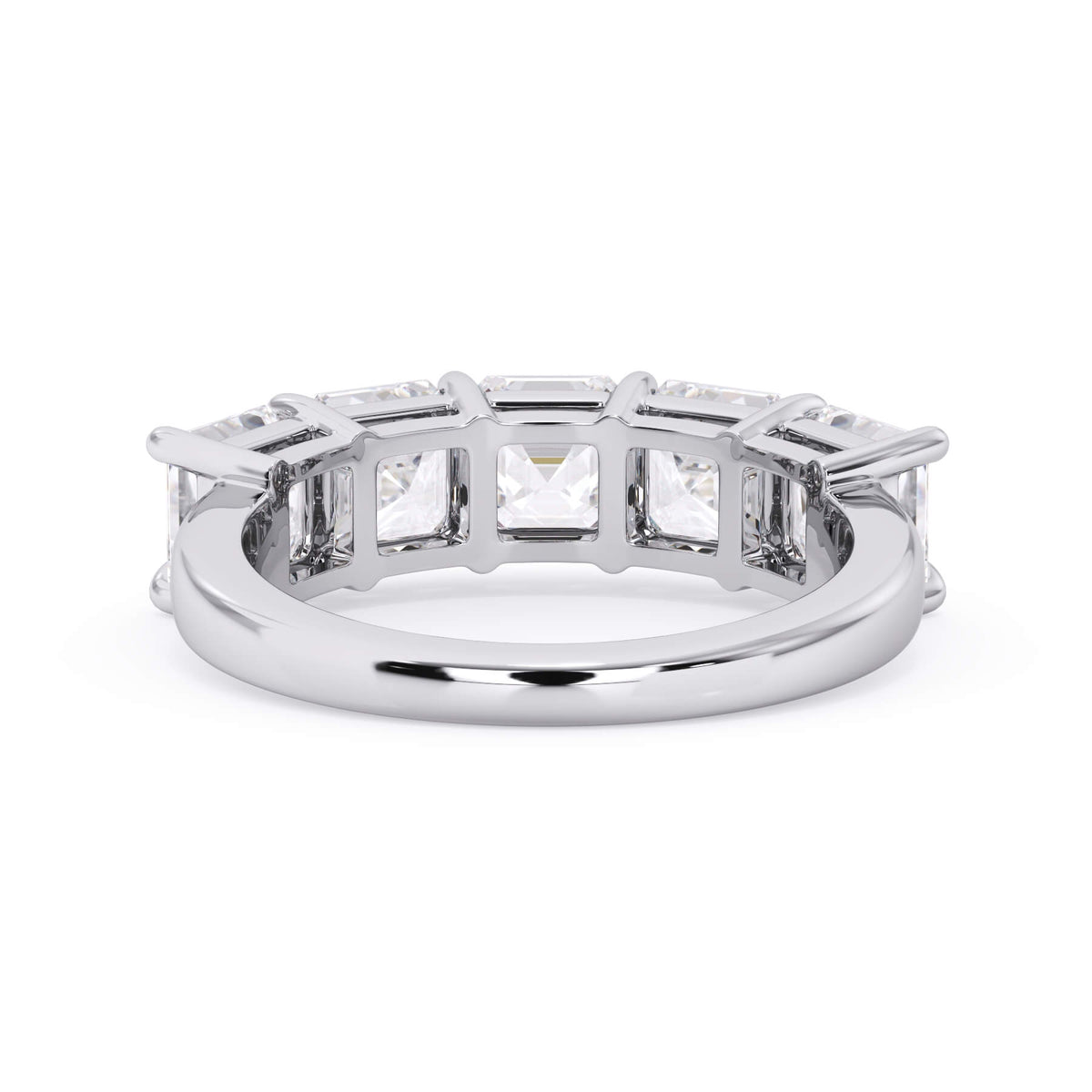 A picture of a five stone diamond wedding ring with asscher shape diamonds that are shared prong set in white gold or platinum on a white background with a view of the underside of the ring.