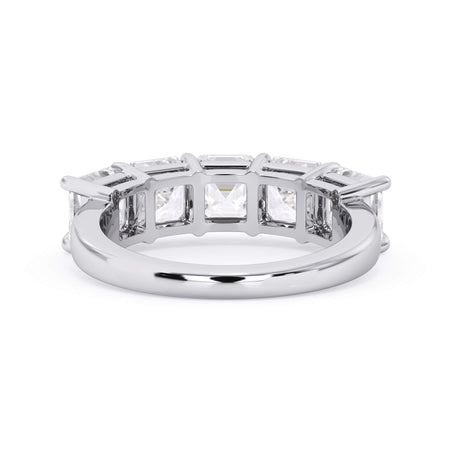 A picture of a five stone diamond wedding ring with asscher shape diamonds that are shared prong set in white gold or platinum on a white background with a view of the underside of the ring.