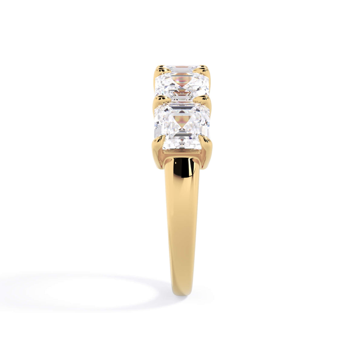 A picture of a five stone diamond wedding ring with asscher shape diamonds that are shared prong set in yellow gold on a white background with a side profile view.