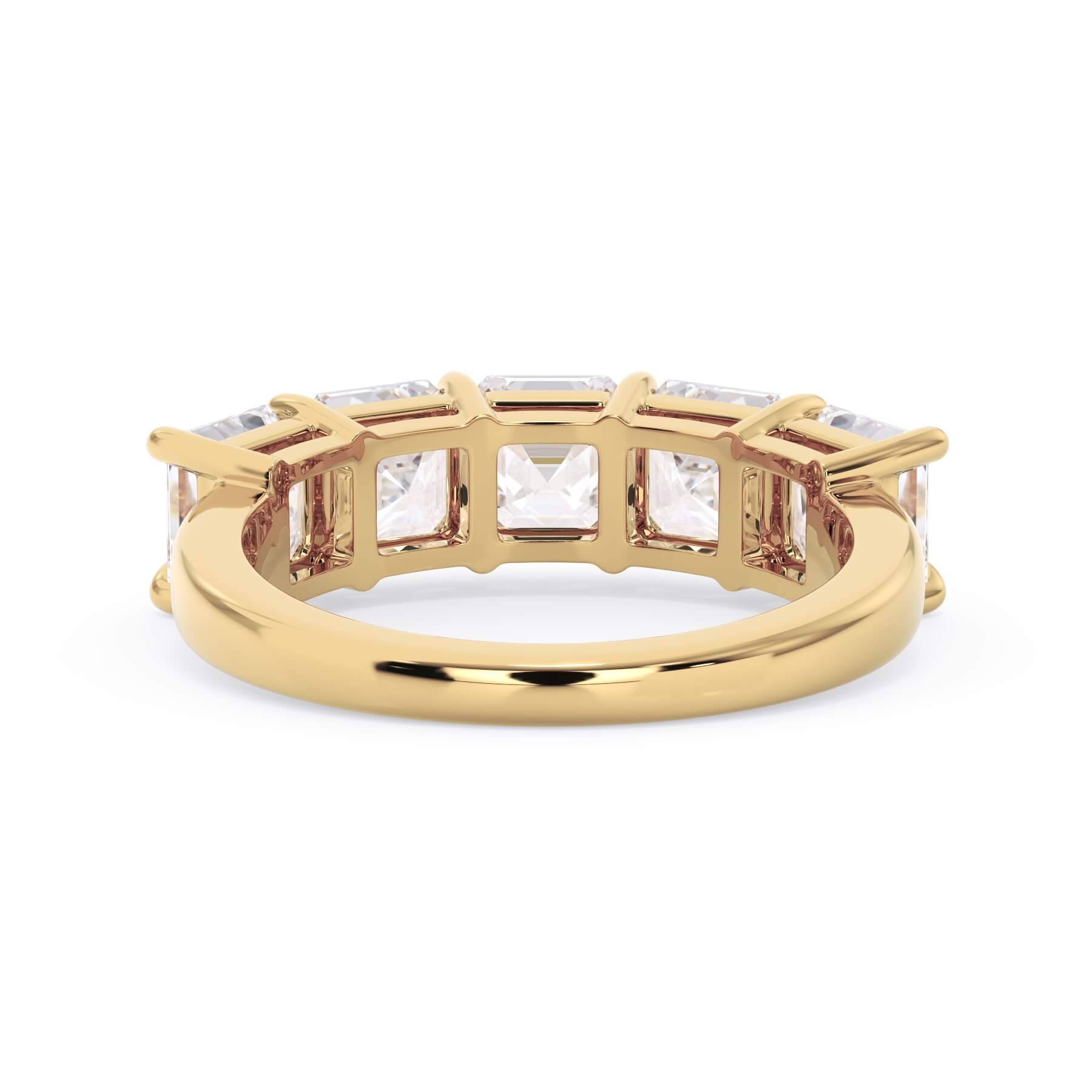 A picture of a five stone diamond wedding ring with asscher shape diamonds that are shared prong set in yellow gold on a white background with a view of the underside of the ring.