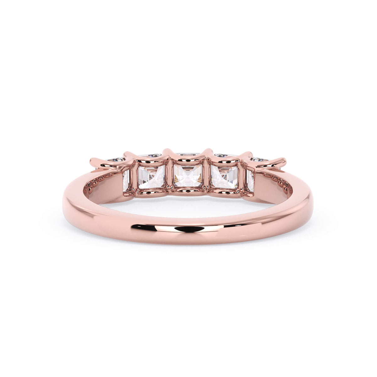 A picture of a five stone diamond wedding ring with asscher shape diamonds that are u prong set in rose gold on a white background with a view of the underside of the ring.