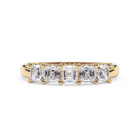 A picture of a five stone diamond wedding ring with asscher shape diamonds that are u prong set in yellow gold on a white background with the ring facing forward, lying down.