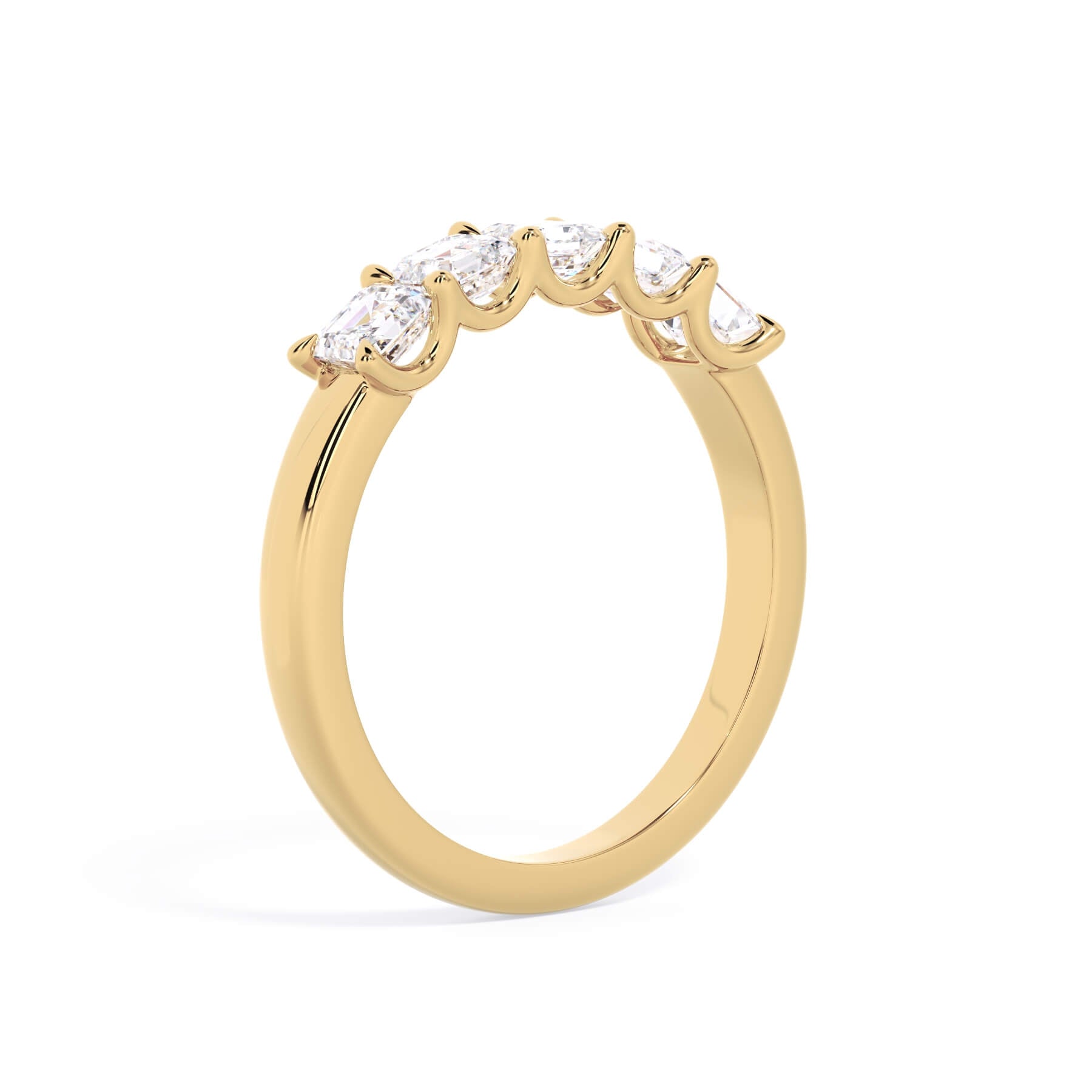 A picture of a five stone diamond wedding ring with asscher shape diamonds that are u prong set in yellow gold on a white background with a slightly angled, through the finger view.