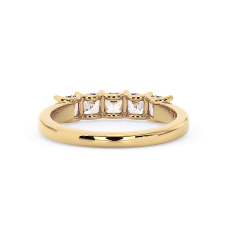 A picture of a five stone diamond wedding ring with asscher shape diamonds that are u prong set in yellow gold on a white background with a view of the underside of the ring.