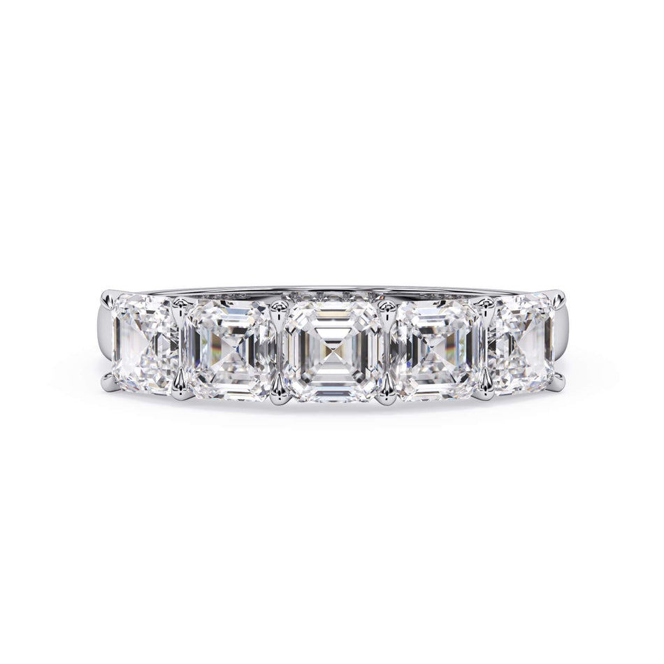 A picture of a five stone diamond wedding ring with asscher shape diamonds that are u prong set in white gold or platinum on a white background with the ring facing forward, lying down.