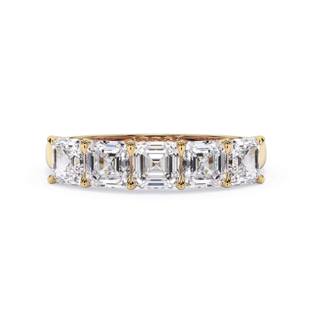 A picture of a five stone diamond wedding ring with asscher shape diamonds that are u prong set in yellow gold on a white background with the ring facing forward, lying down.
