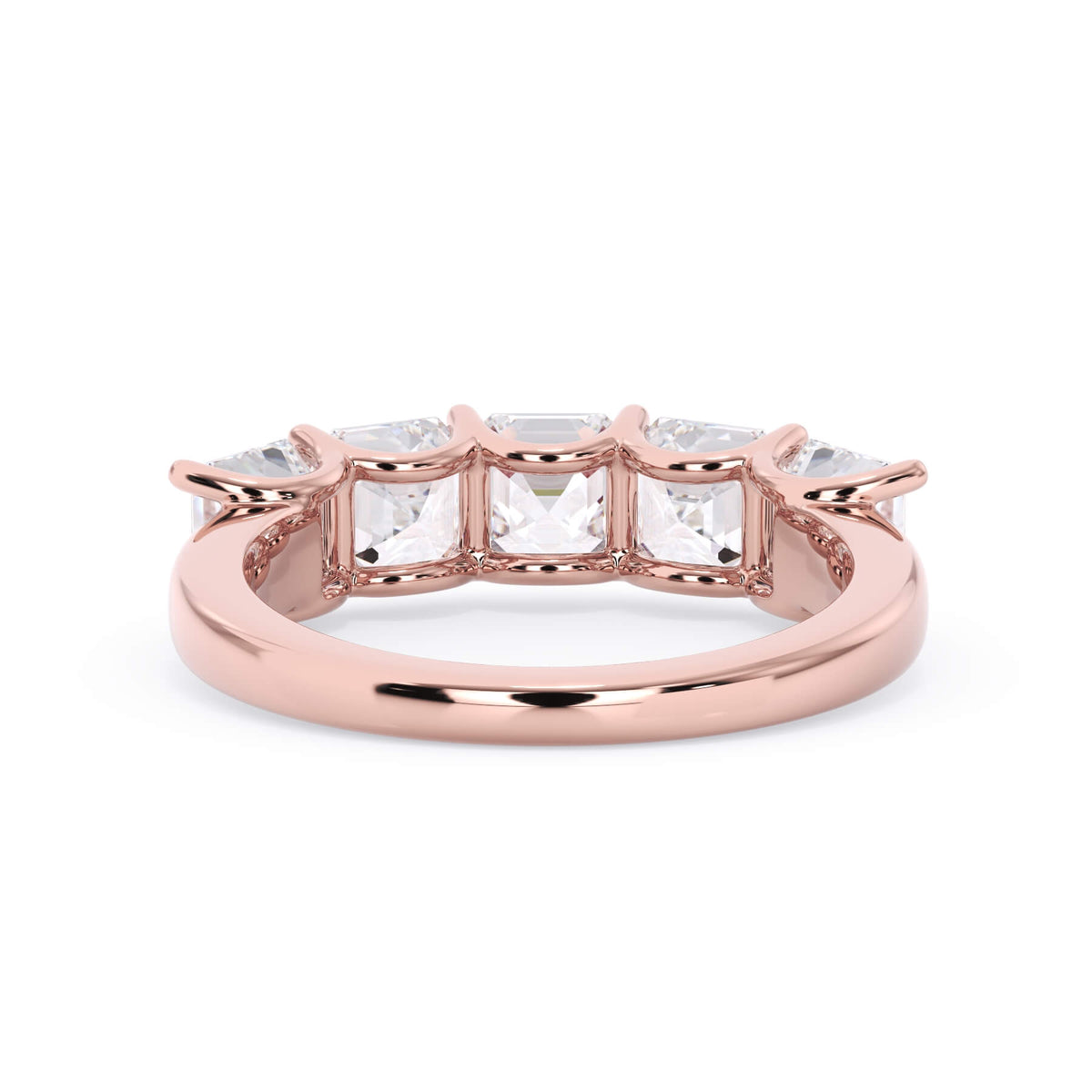 A picture of a five stone diamond wedding ring with asscher shape diamonds that are u prong set in rose gold on a white background with a view of the underside of the ring.