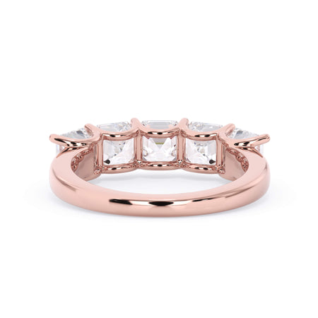 A picture of a five stone diamond wedding ring with asscher shape diamonds that are u prong set in rose gold on a white background with a view of the underside of the ring.