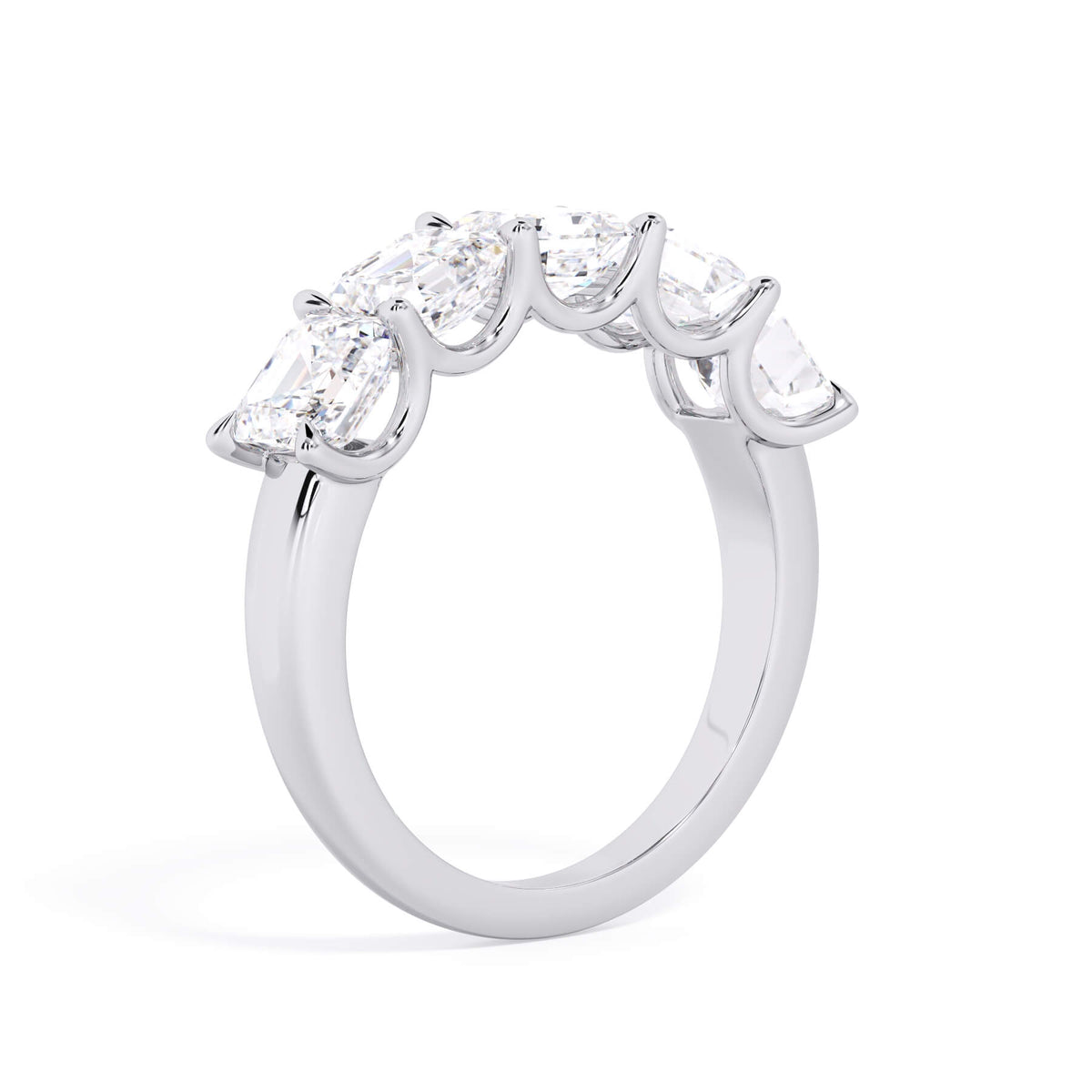 A picture of a five stone diamond wedding ring with asscher shape diamonds that are u prong set in white gold or platinum on a white background with a slightly angled, through the finger view.