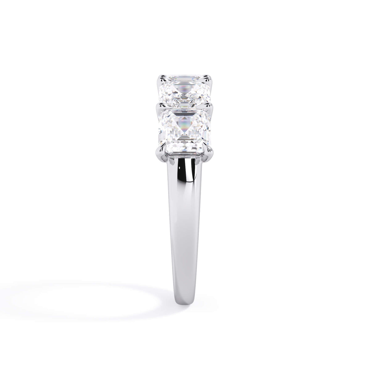 A picture of a five stone diamond wedding ring with asscher shape diamonds that are u prong set in white gold or platinum on a white background with a side profile view.