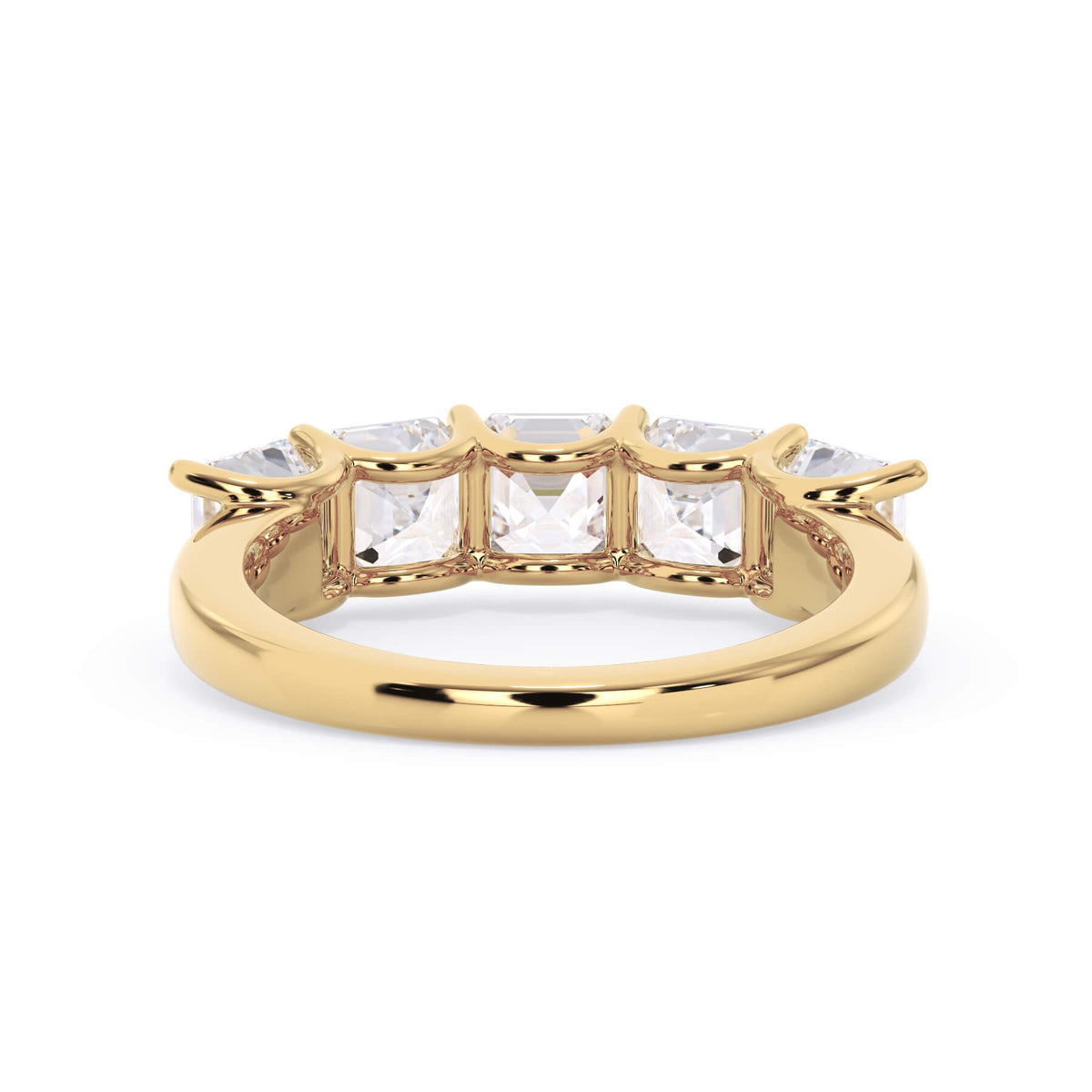 A picture of a five stone diamond wedding ring with asscher shape diamonds that are u prong set in yellow gold on a white background with a view of the underside of the ring.