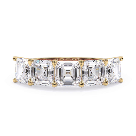 A picture of a five stone diamond wedding ring with asscher shape diamonds that are u prong set in yellow gold on a white background with the ring facing forward, lying down.
