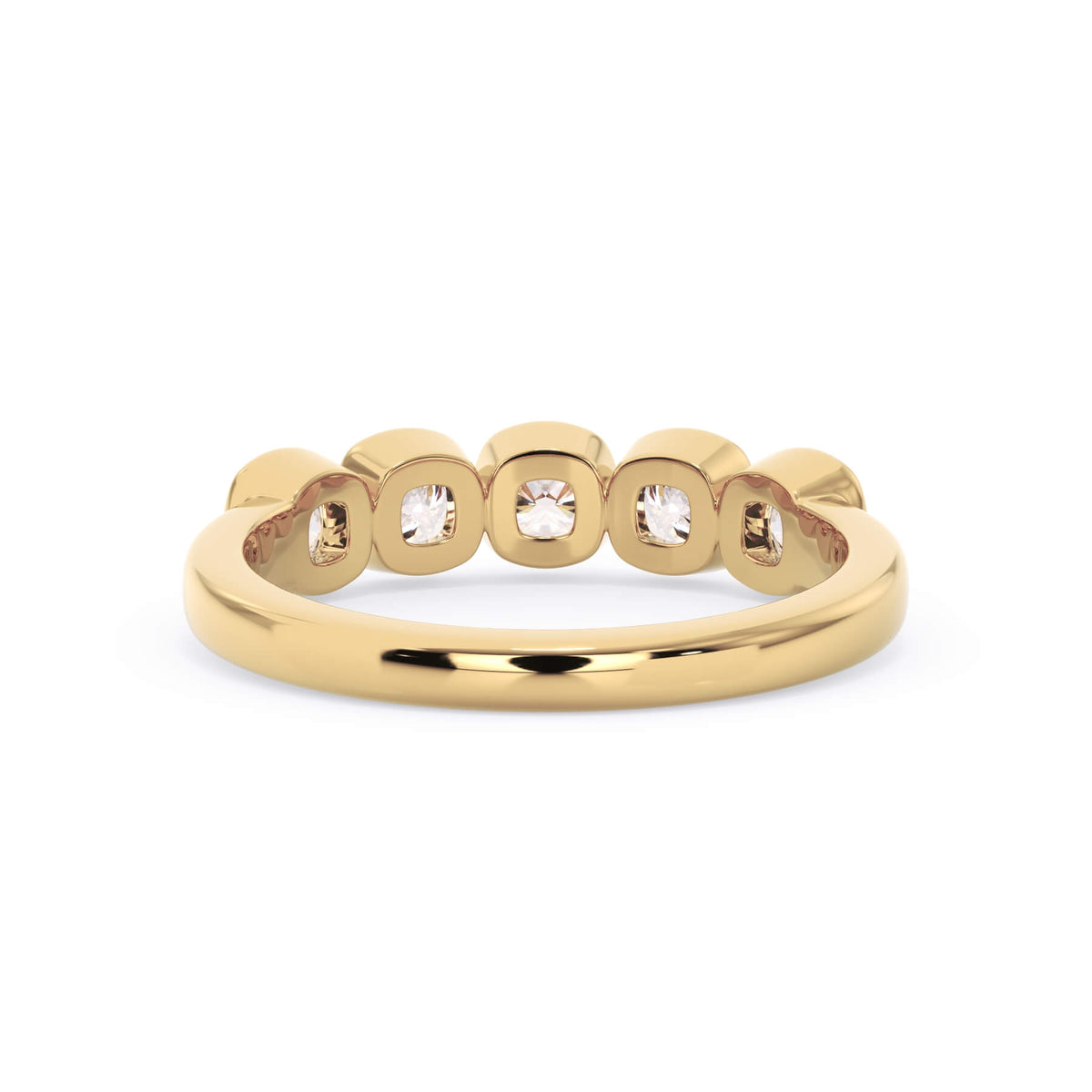 A picture of a five stone diamond wedding ring with cushion shape diamonds that are bezel set in yellow gold on a white background with a view of the underside of the ring.