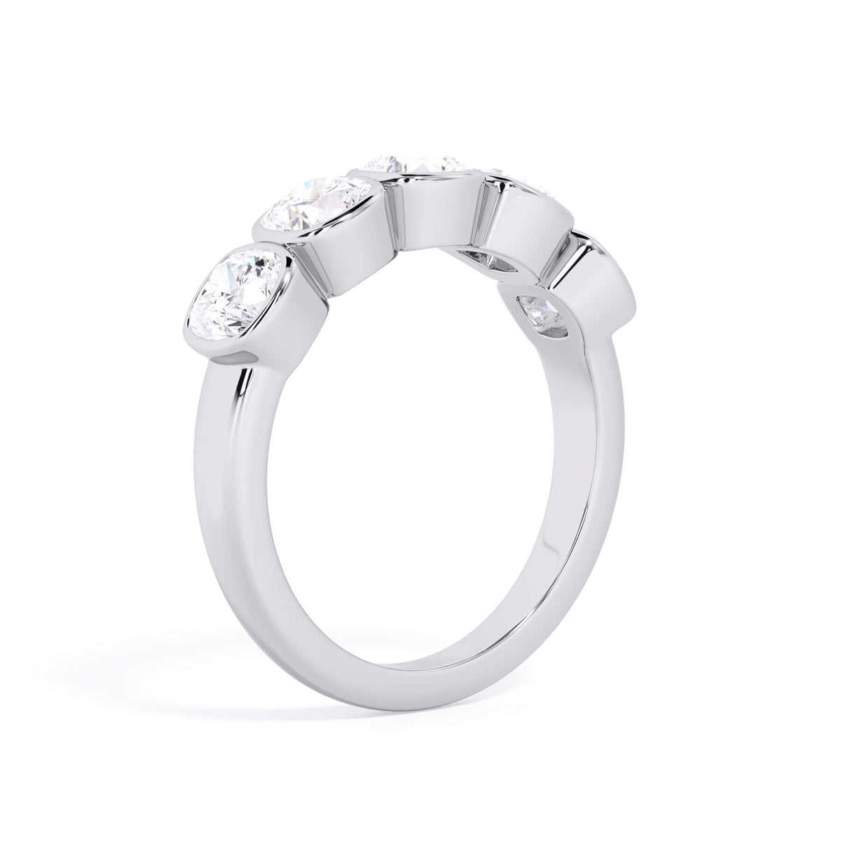 A picture of a five stone diamond wedding ring with cushion shape diamonds that are bezel set in white gold or platinum on a white background with a slightly angled, through the finger view.