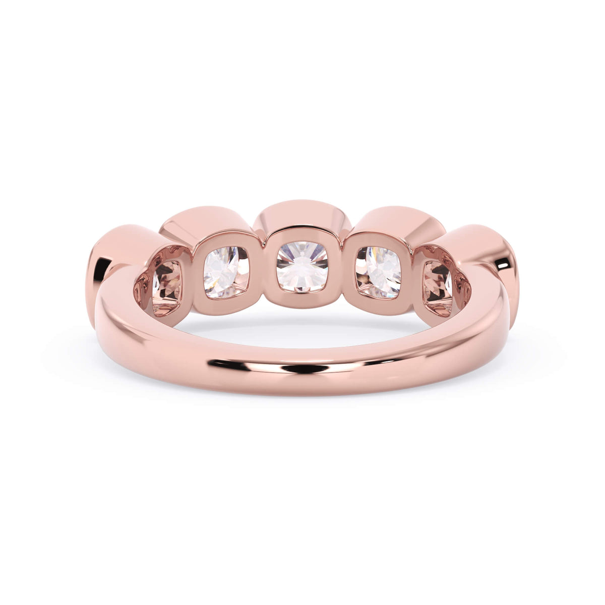 A picture of a five stone diamond wedding ring with cushion shape diamonds that are bezel set in rose gold on a white background with a view of the underside of the ring.