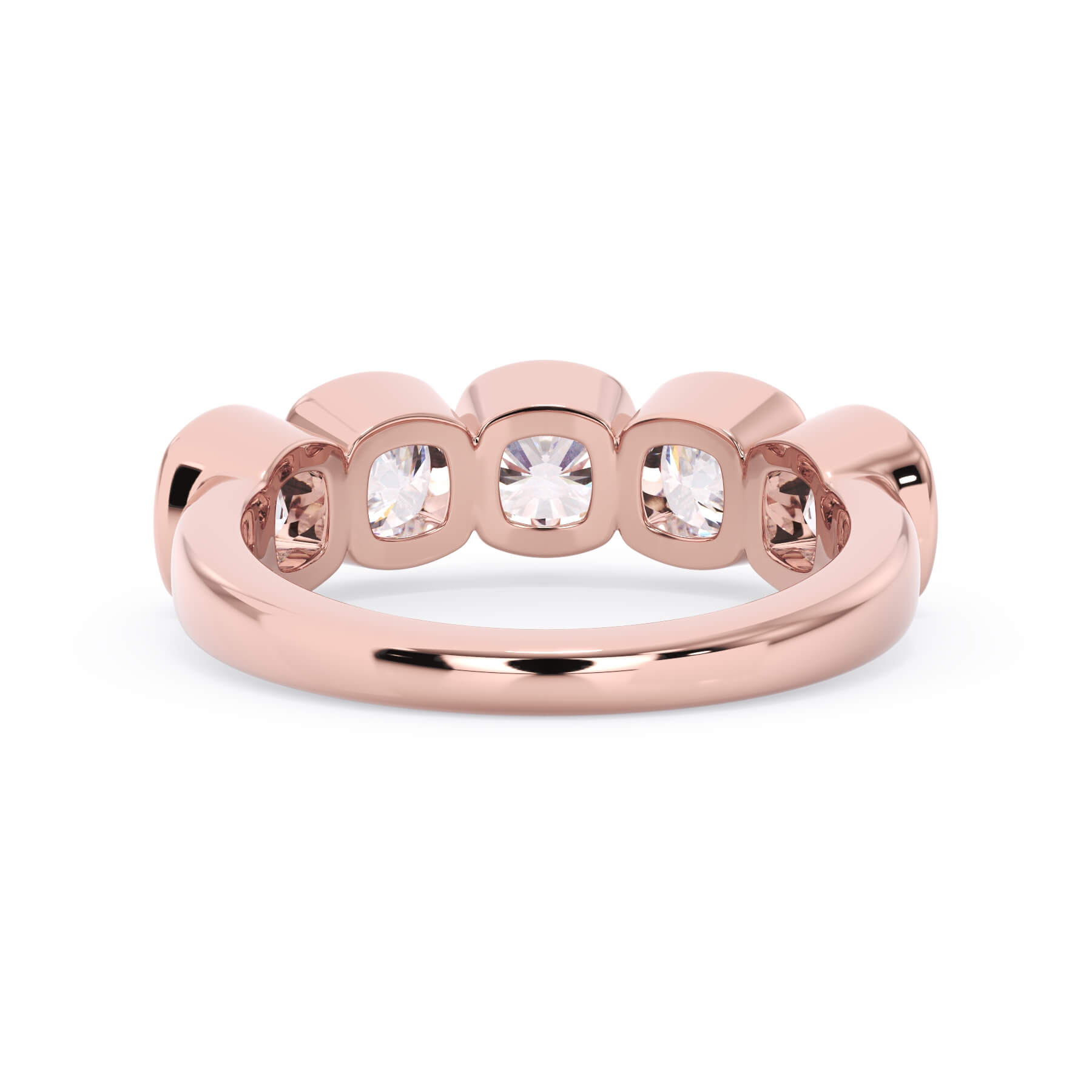 A picture of a five stone diamond wedding ring with cushion shape diamonds that are bezel set in rose gold on a white background with a view of the underside of the ring.