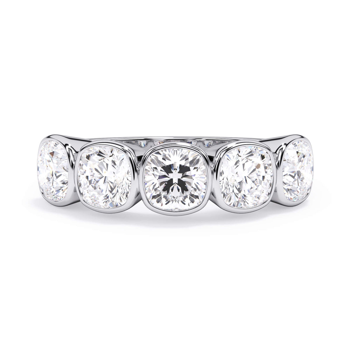 A picture of a five stone diamond wedding ring with cushion shape diamonds that are bezel set in white gold or platinum on a white background with the ring facing forward, lying down.