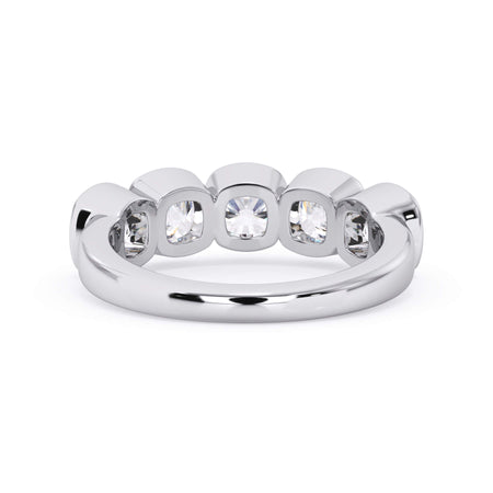 A picture of a five stone diamond wedding ring with cushion shape diamonds that are bezel set in white gold or platinum on a white background with a view of the underside of the ring.