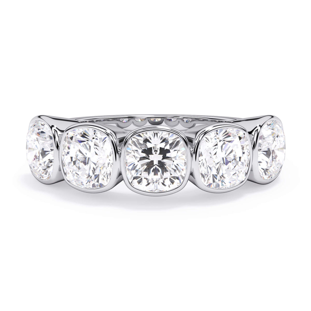 A picture of a five stone diamond wedding ring with cushion shape diamonds that are bezel set in white gold or platinum on a white background with the ring facing forward, lying down.