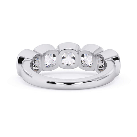 A picture of a five stone diamond wedding ring with cushion shape diamonds that are bezel set in white gold or platinum on a white background with a view of the underside of the ring.